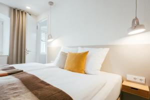 Postel nebo postele na pokoji v ubytování STADTQUARTIER Windischeschenbach + 16 fotografií