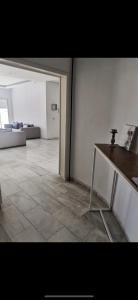 a living room with a table and a couch at Appartement panorama in Tunis