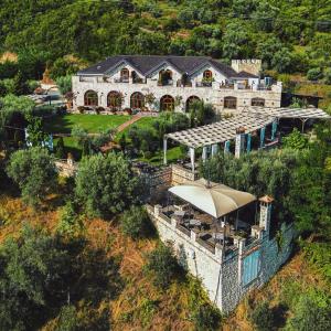 an aerial view of a large house on a hill at Chateau Fasel in Tirana