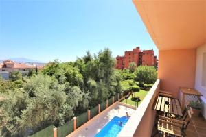 a view of a swimming pool from a balcony at Estepona Town Apartment CARMEN in Estepona