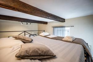 Posteľ alebo postele v izbe v ubytovaní Roommo Apartments San Gallo