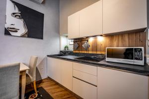Kuchyňa alebo kuchynka v ubytovaní Roommo Apartments San Gallo