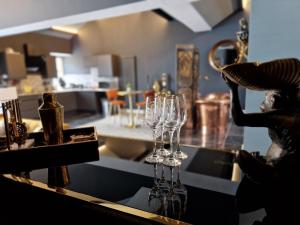 a group of wine glasses sitting on a counter at The Studio in Preston