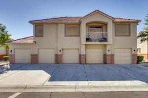 a house with four garage doors in a driveway at Mesquite Vacation Rental Condo with Community Pool! in Mesquite