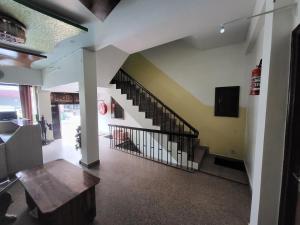 a hallway with a staircase in a building at Hotel Atithi Residency in Lucknow