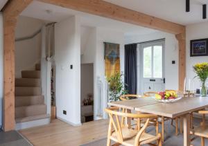 a kitchen and dining room with a table and chairs at Relax, unwind and enjoy village life.... in Castle Acre