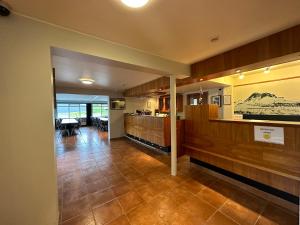 a room with a kitchen and a living room at Hótel Austur in Reyðarfjörður