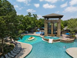 a pool at a resort with a gazebo at The Woodlands Resort, Curio Collection by Hilton in The Woodlands