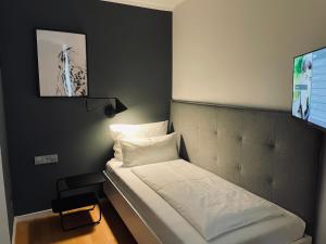Postel nebo postele na pokoji v ubytování DK Hotel Heidelberg