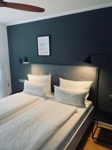 Postel nebo postele na pokoji v ubytování DK Hotel Heidelberg