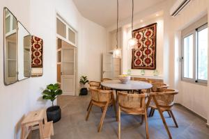 a dining room with a table and chairs at Lemontrees Residences in Rhodes Town