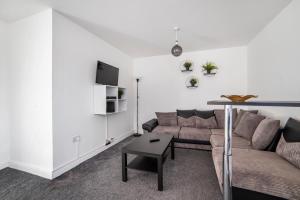 a living room with a couch and a table at Leicester City Center Perfect stay in Leicester