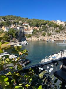 a view of a harbor with boats in the water at Cabanon vue mer L ilette Niolon Côte bleue in Le Rove