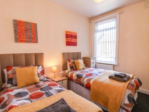 Postel nebo postele na pokoji v ubytování Moorland House