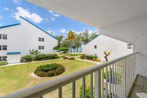 a view from the balcony of a white building at Villas of the Galleon #6 in Seven Mile Beach