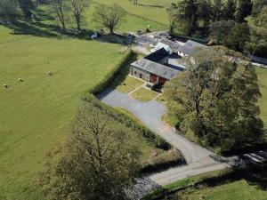 an aerial view of a house in a field at Peregrine Stable Cottage in Llandovery