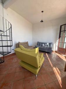 a living room with two couches and a couch at Casa Laberinto in San Miguel de Allende