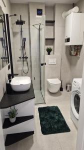 Ένα μπάνιο στο Apartament Gimnazjalna Prestige +8 φωτογραφίες