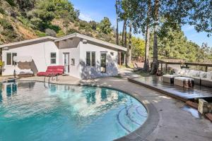 a swimming pool in front of a house at Hillside Canyon, Private Home W/ Pool and Nature in Los Angeles