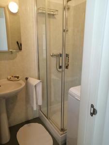 a bathroom with a shower and a toilet and a sink at Casa Vacanze Patrizia in Montescaglioso +24 photos