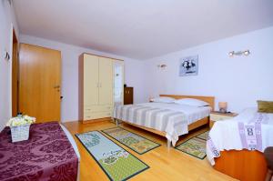 Łóżko lub łóżka w pokoju w obiekcie Apartment Diamar