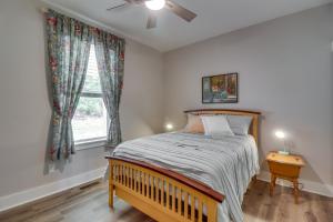 a bedroom with a bed and a window at Secluded Barboursville Home with Covered Porch! in Barboursville