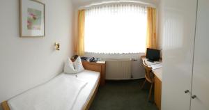 Postel nebo postele na pokoji v ubytování Hotel Garni Schmid