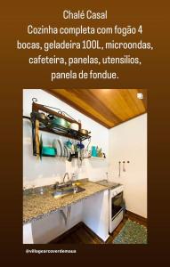 a kitchen with a sink and a counter top at Village Arcoverde - Visconde de Mauá in Bocaina de Minas