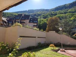a view from the back yard of a house at Studio cosy Edelweiss in Luchon