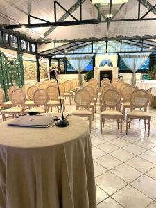 a room with a table and chairs with a laptop on it at Villa Euchelia in Castrocielo +80 photos