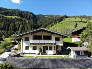 a house in the mountains with a view at Appartement Josefine in Bramberg am Wildkogel