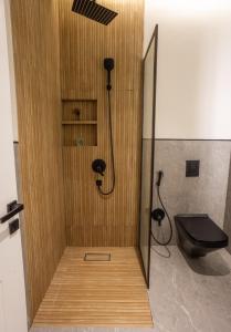 a shower with a black toilet in a bathroom at ملاذ 1 in Riyadh +11 photos