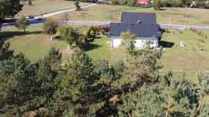 an aerial view of a house with a yard at Domek całoroczny na Kaszubach in Lipusz