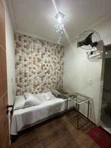 Posteľ alebo postele v izbe v ubytovaní Hotel e Pousada Império Barão