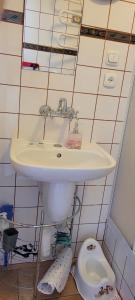 a bathroom with a sink and a toilet at BetulaAPART - Apartament z widokiem na morze in Ustka