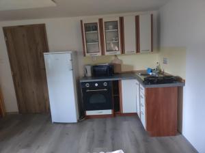 Cucina o angolo cottura di Lesní chaty "Hogo Fogo"
