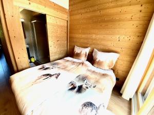 a bedroom with a bed with animals on it at Chalet Neuf, Morgins in Morgins