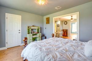 a bedroom with a large white bed in a room at Peaceful Haynesville Vacation Rental with Yard! in Haynesville