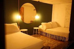 Posteľ alebo postele v izbe v ubytovaní Siete Hierbas Hostal