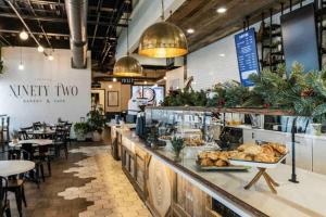 a bakery with a counter with tables and chairs at NEW*The Wild Cactus- Best of LBK w/TennisCourts in Lubbock