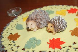 two hedgehogs on top of a birthday cake at Casa Dănuț in Reşiţa