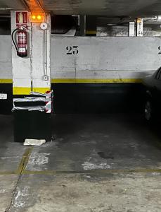 a fire truck parked in a parking garage at Sevilla Alameda PG Apartamentos in Seville