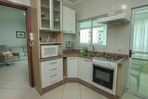 Η κουζίνα ή μικρή κουζίνα στο Apto. aconchegante #roda gigante