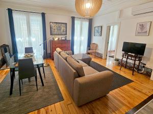 a living room with a couch and a table at Stay at Home in Lisbon in Lisbon