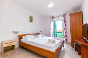 Postel nebo postele na pokoji v ubytování Apartments Marijana