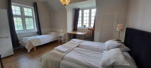 Katil atau katil-katil dalam bilik di Halmstad Hotell & Vandrarhem Kaptenshamn