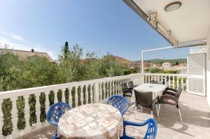 a patio with a table and chairs on a balcony at Apartments Mirjana in Vodice