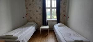 Katil atau katil-katil dalam bilik di Halmstad Hotell & Vandrarhem Kaptenshamn