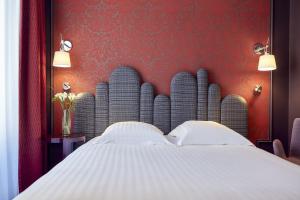 Postel nebo postele na pokoji v ubytování Grand Hôtel du Midi Montpellier - Opéra Comédie