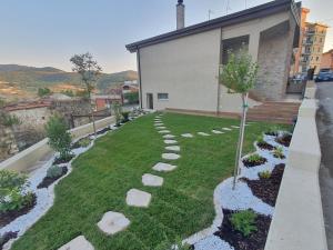 a garden with rocks in front of a house at Le stagioni della vita in Bovino